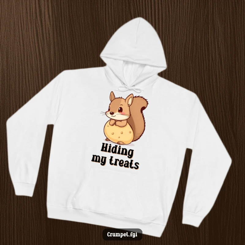 Funny hoodie showing a mischievous squirrel peeking from behind a big crumpet with a playful glint.