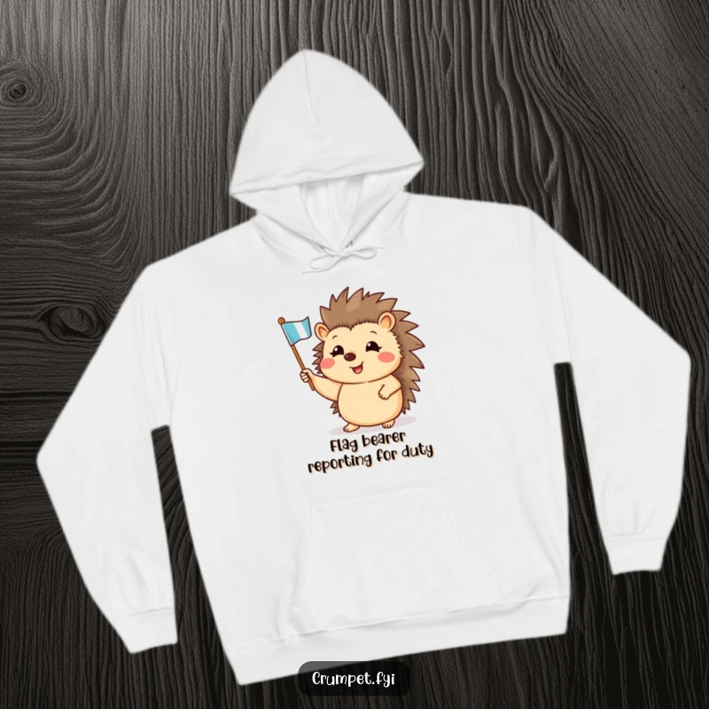 Funny hoodie featuring a smiling hedgehog waving a miniature flag, offering warmth and cheerfulness.