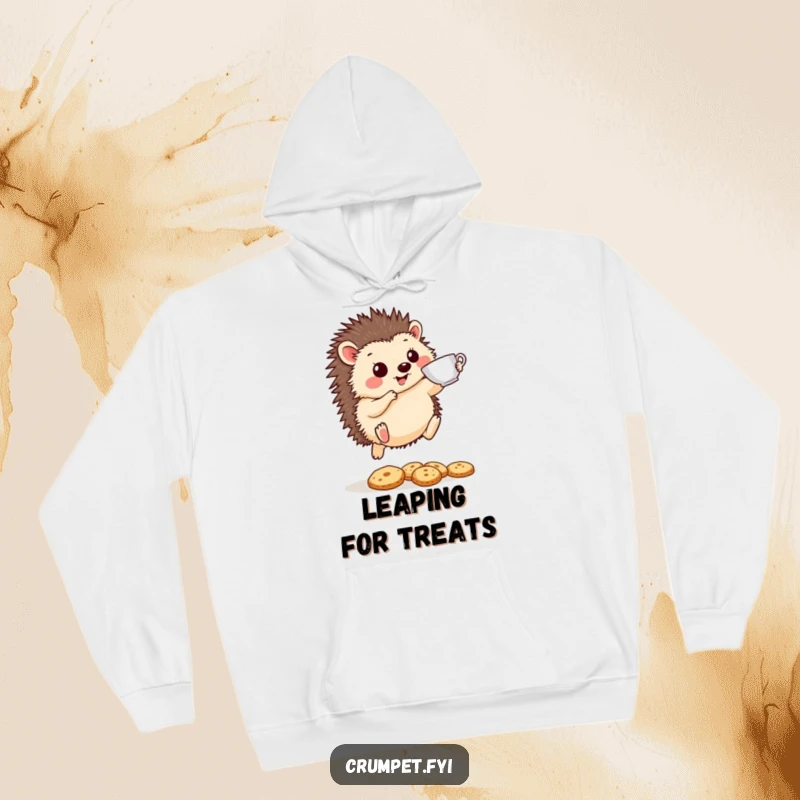 Funny Hedgehog Hoodie: A cheerful hedgehog leaps with a teacup over biscuits, providing cozy comfort and hilarious tea-time antics.