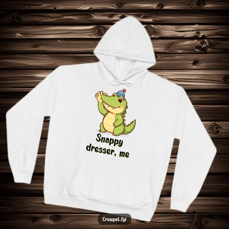 Funny crocodile hoodie showing a smiling crocodile in a tiny hat, offering warmth and a friendly wave. Ideal for cozy, humorous comfort.